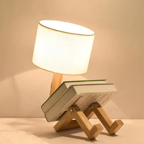 iRobot Shape Customizable Desk Lamp with a unique robot design, made from durable wood and fabric, adding a touch of fun and style to any room.