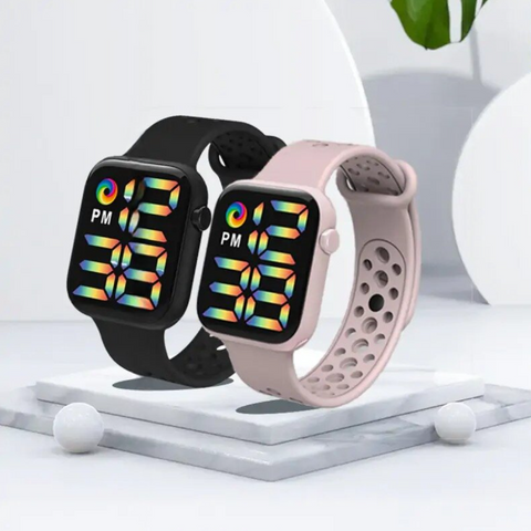 PrismTime LED Smartwatch with a vivid color display, available in black and pink with a perforated silicone strap. Lightweight, water-resistant, and perfect for everyday wear and fitness tracking.