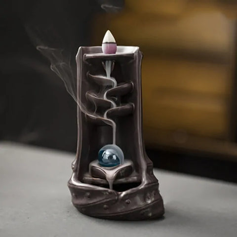 Ethereal Waterfall Incense Burner made of ceramic, featuring a cascading smoke design with a bergamot lotus motif, creating a tranquil and elegant ambiance.