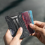 SpaceGrade Carbon Fiber Wallet with sleek and minimalist design, showcasing advanced aerospace materials and RFID blocking technology for ultimate security.