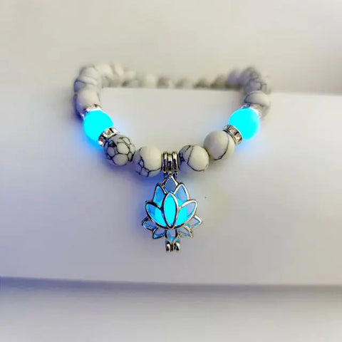 Blue Lotus Natural Glow Stone Bracelet featuring luminous stones and a lotus charm bead, glowing in the dark to add an enchanting touch to your style.