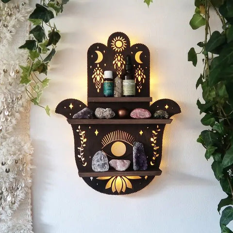 Mystic Designer Wooden Shelf featuring intricate patterns and a natural wood finish, mounted on a wall and adorned with essential oils, crystals, and decorative items, creating a charming and rustic ambiance.