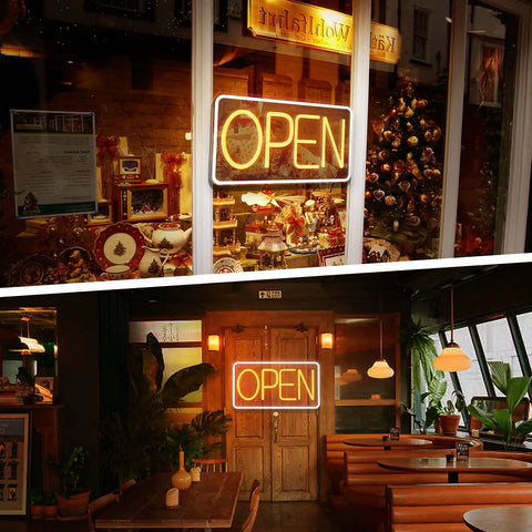 Open Vintage Neon Lamp with bright yellow LED lights displayed in a window, surrounded by flowers and creating a welcoming atmosphere for a business.