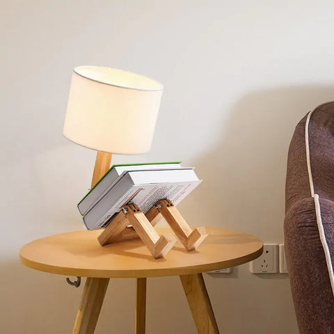 iRobot Shape Customizable Desk Lamp with a unique robot design, made from durable wood and fabric, adding a touch of fun and style to any room.