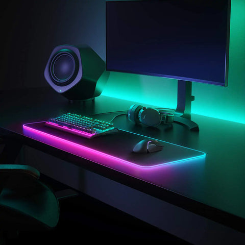 Futuristic RGB Gaming Mousepad with 12 dynamic lighting modes, offering an expansive and ultra-smooth surface for enhanced gaming control and precision.