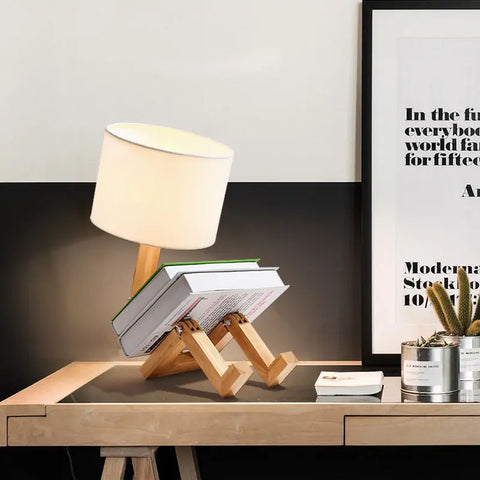 iRobot Shape Customizable Desk Lamp with a unique robot design, made from durable wood and fabric, adding a touch of fun and style to any room.