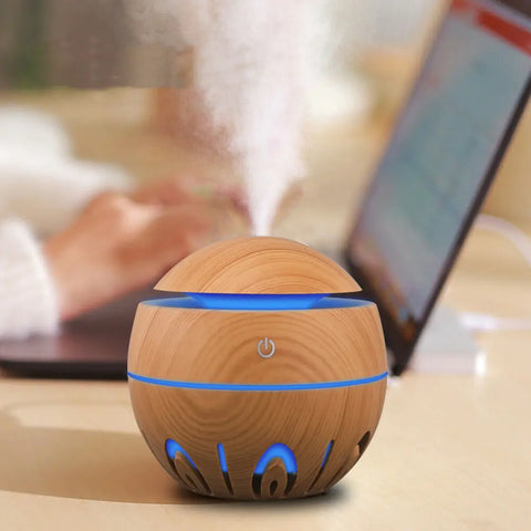 Premium Wooden Ultrasonic Air Diffuser with a sleek design, perfect for home or car use, releasing a fine mist infused with essential oils for relaxation and improved air quality.