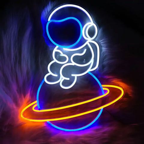 Lonely Astronaut Neon Wall Light featuring a cute astronaut sitting on a glowing planet, perfect for space-themed decor and kids' bedrooms.