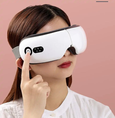 Modern Eye Massager with Bluetooth, hot compress function, and blue light protection, designed for relaxation and eye strain relief, shown in use by a woman.