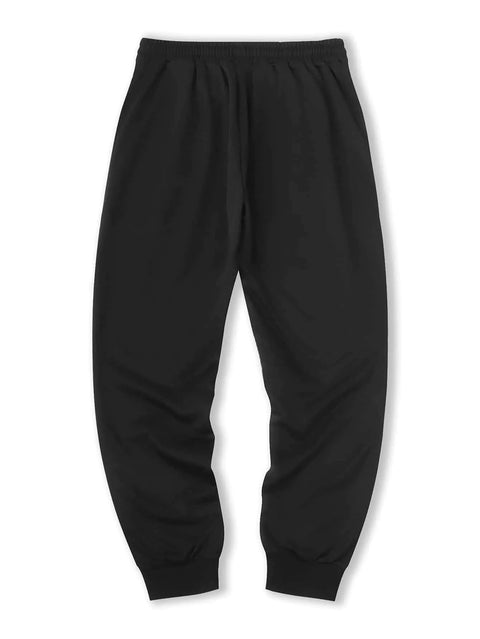 Grim Hustle Men's Sweatpants featuring a bold graphic design, drawstring waist, and high-quality fabric for a stylish and comfortable fit